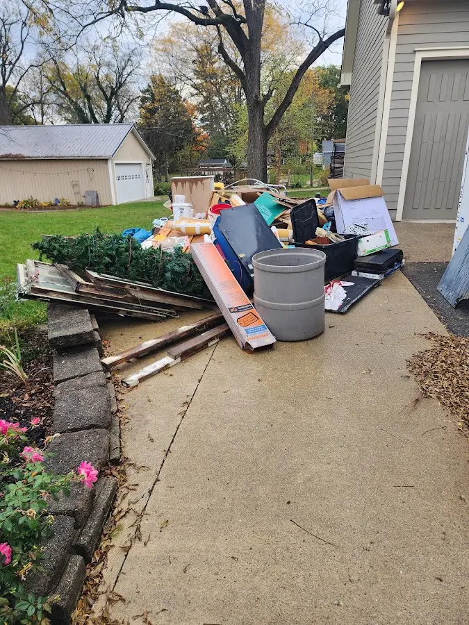 Dumpster being loaded with debris for Residential Dumpster Rental in Kennedale